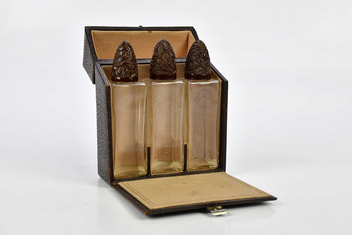 Lot 1574 - A cased set of three 1920s perfume bottles