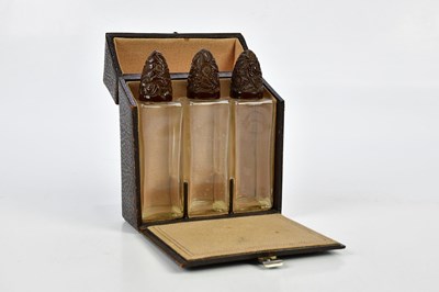 Lot 1574 - A cased set of three 1920s perfume bottles...