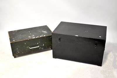 Lot 39 - A black painted pine travel trunk with twin carry handles