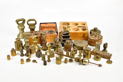 Lot 733 - A collection of brass, iron and metal weights,...