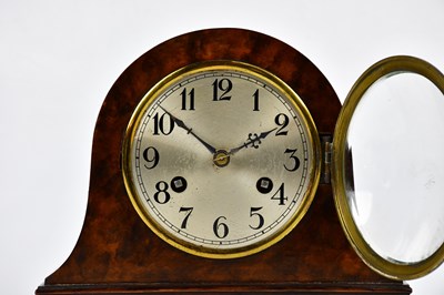 Lot 400 - A 1930s walnut mantel clock with silvered dial...