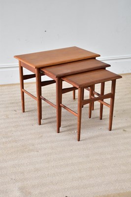 Lot 226 - A mid 20th century teak nest of three tables,...