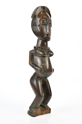 Lot 1331 - A carved African figure, height 49cm.