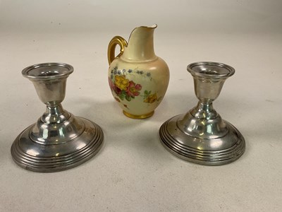 Lot 377 - A pair of silver candlesticks, weighted,...