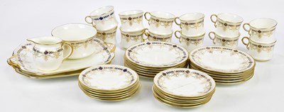 Lot 1499 - CAULDON; a part tea service with gilt and...