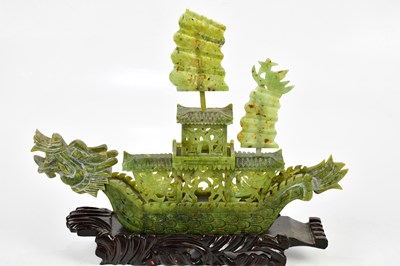 Lot 1205 - A Chinese hardstone model of a junk, the mast...