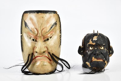 Lot 1286 - Two painted wooden 1930s face masks, largest...