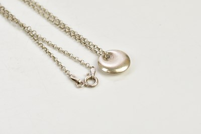 Lot 875 - TIFFANY & CO; a 925 grade silver pendant...