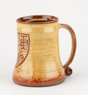 Lot 65 - Leach Pottery; a slipware mug decorated with a...