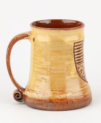 Lot 65 - Leach Pottery; a slipware mug decorated with a...