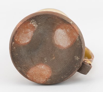 Lot 65 - Leach Pottery; a slipware mug decorated with a...