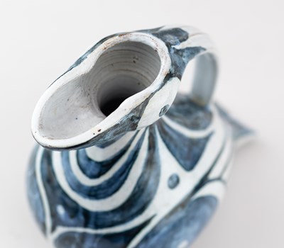 Lot 459 - PAT BIRKS; a tin glazed earthenware jug...