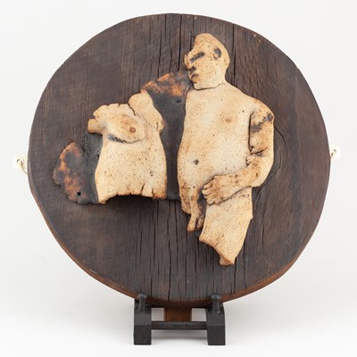 Lot 731 - A stoneware wall sculpture of a naked couple...