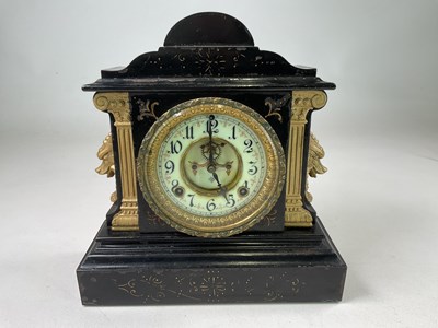 Lot 524 - ANSONIA CLOCK CO; a mantel clock in black...