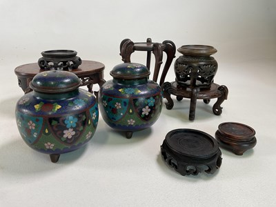 Lot 346 - A pair of squat cloisonné jars and covers...