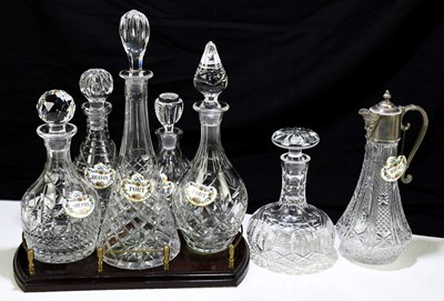 Lot 523 - A collection of six cut glass decanters and...