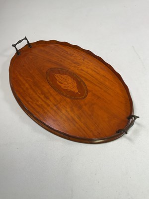 Lot 10 - An Edwardian satinwood twin handled tray with...