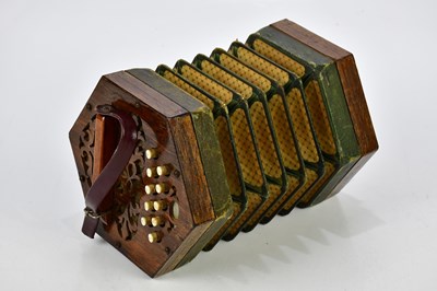 Lot 1110 - A late 19th century 21-key concertina.