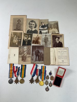Lot 82 - Two WWI medal trios, the first awarded to...