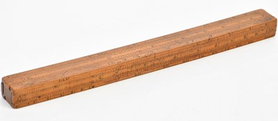 Lot 585 - A 19th century boxwood ruler with four slides...