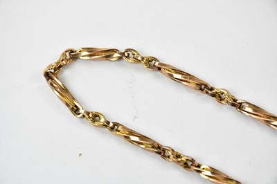 Lot 2358 - A 9ct gold trombone link Albert chain with...