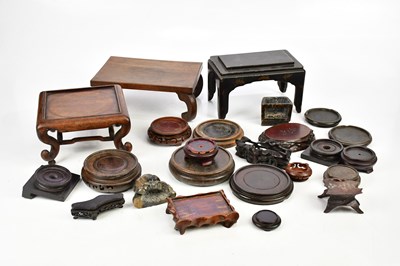 Lot 1316 - A collection of wooden Oriental stands.