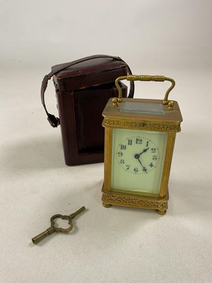 Lot 532 - A brass carriage clock with pierced decoration...