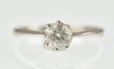 Lot 1019 - A 9ct gold solitaire ring with claw set round...
