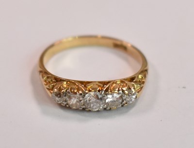 Lot 395 - An 18ct yellow gold five stone graduated...