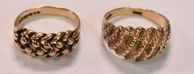 Lot 447 - Two 9ct yellow gold rings with domed studded...