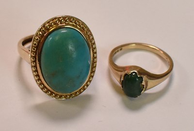 Lot 448 - A 9ct yellow gold turquoise cabochon oval...