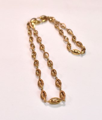 Lot 426 - A 9ct yellow gold open lozenge shaped link...