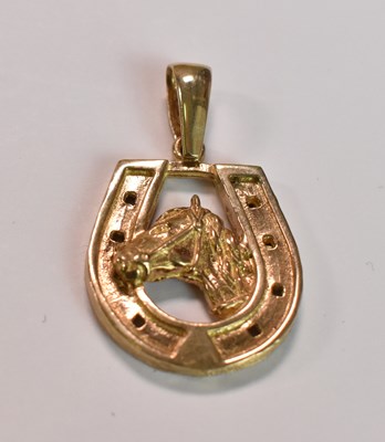 Lot 440 - A 9ct yellow gold pendant in the form of a...