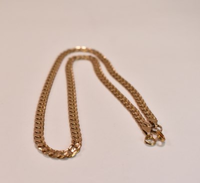 Lot 392 - A 9ct yellow gold flat curb link chain, length...