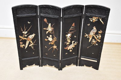 Lot 1279 - An early 20th century Japanese lacquered four...