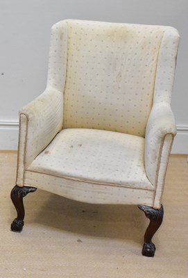 Lot 185 - An early 20th century wingback armchair,...