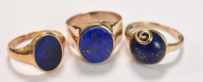 Lot 416 - Two 9ct yellow gold and a yellow metal ring,...