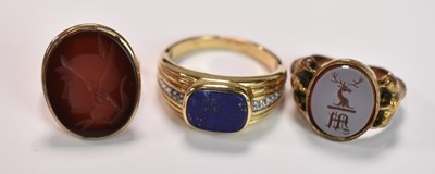 Lot 407 - Three yellow metal rings, one set with a...