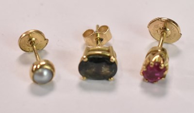 Lot 488 - Three 18ct yellow gold single studs.