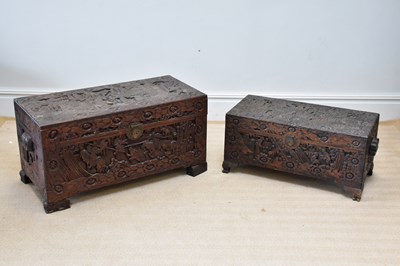 Lot 1298 - Two carved camphor wood chests, larger 48 x 94...