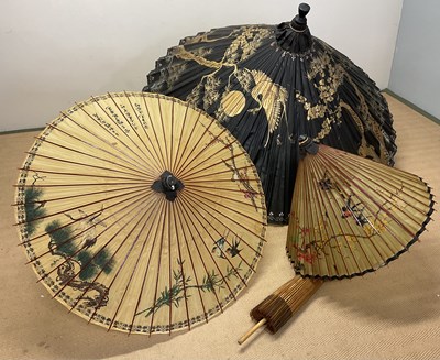 Lot 16 - An impressive Chinese parasol decorated with...