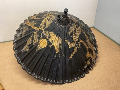 Lot 16 - An impressive Chinese parasol decorated with...
