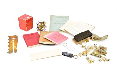 Lot 2611 - A collection of military cap badges, ephemera...