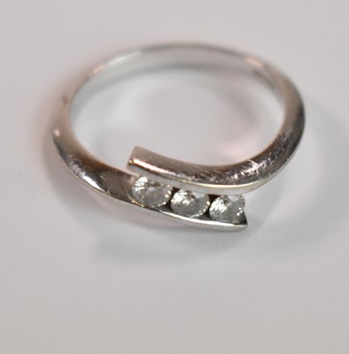 Lot 420 - An 18ct white gold and diamond three stone...