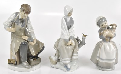 Lot 599 - LLADRO; two figures, to include a cobbler,...