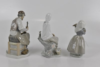 Lot 599 - LLADRO; two figures, to include a cobbler,...