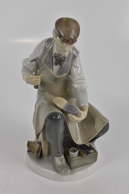 Lot 599 - LLADRO; two figures, to include a cobbler,...