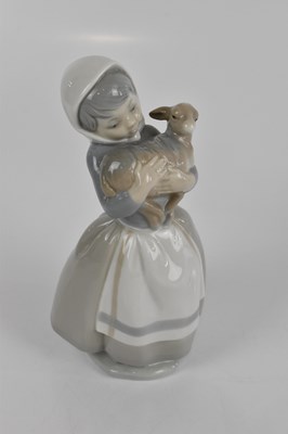 Lot 599 - LLADRO; two figures, to include a cobbler,...