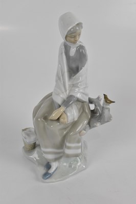 Lot 599 - LLADRO; two figures, to include a cobbler,...