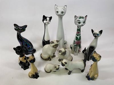 Lot 298 - A collection of ceramic cats, tallest 42cm, by...